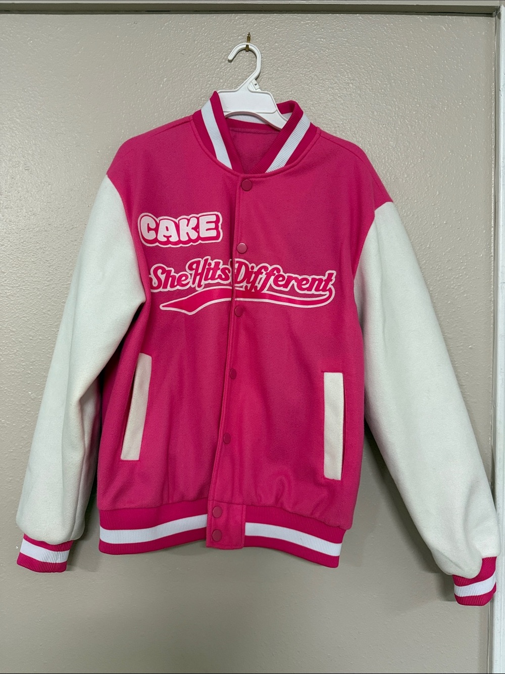 NWOT Cake "She Hits Different Varsity Pink Jacket